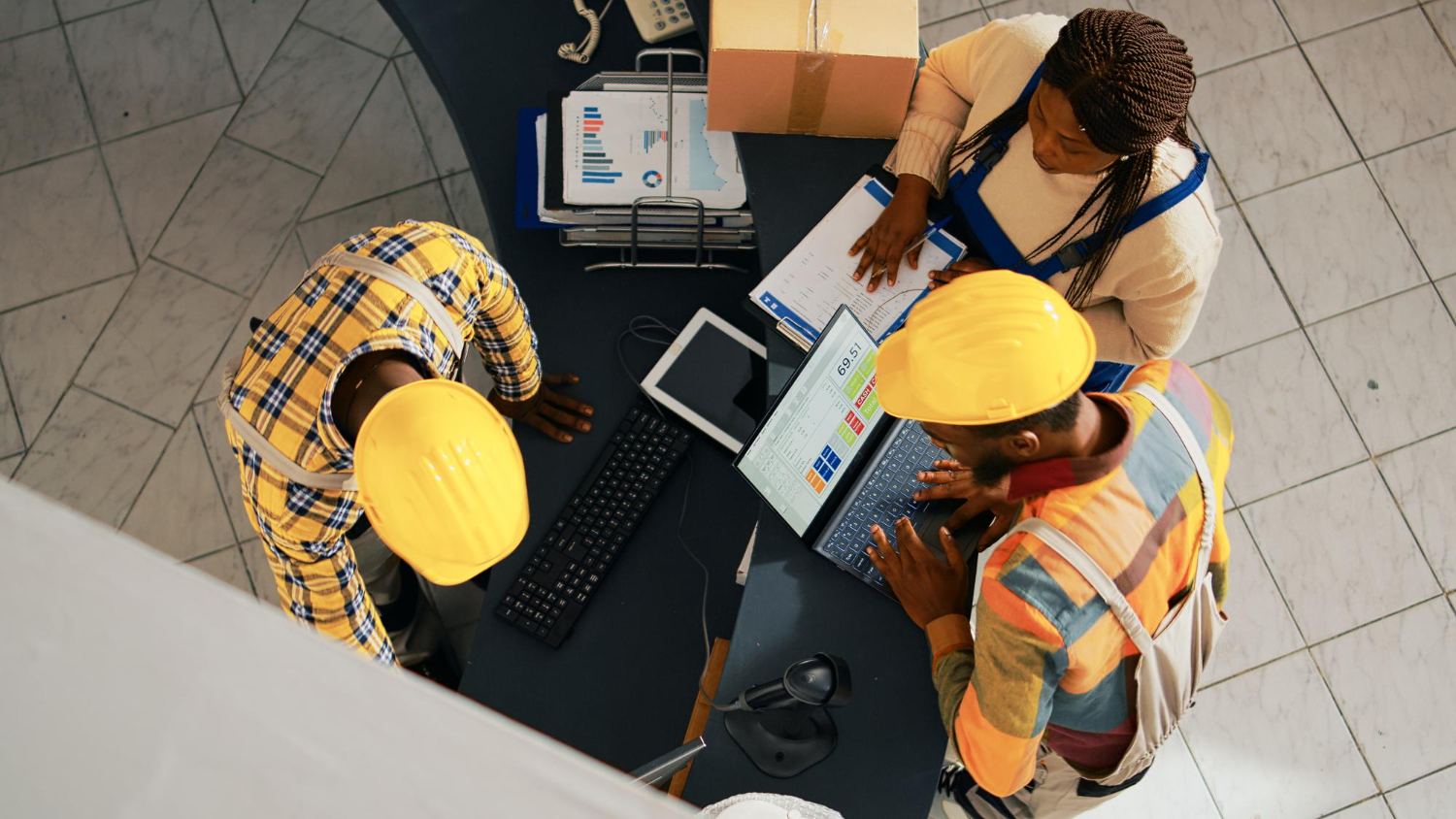 Bird-eye view of professionals working at a desk